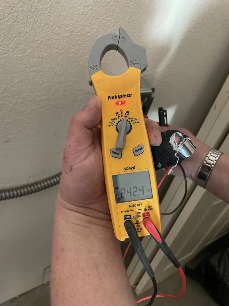 Voltage testing with clamp meter during Recessed Lighting Installation in Brent